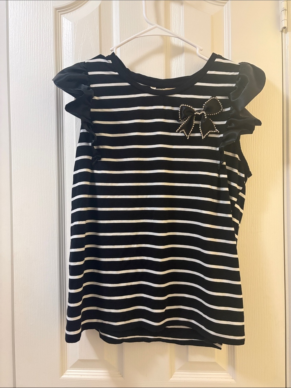 54 Black & White Striped Ruffle Sleeve Top with Decorative Bow